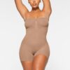 SEAMLESS SCULPT STRAPLESS SHORTIE BODYSUIT
